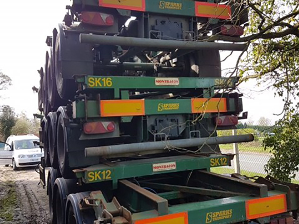 stack of green skeleton trailers