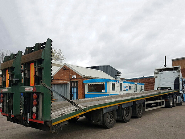 green low loader trailer