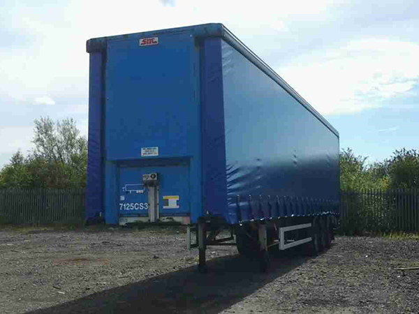 blue montracon trailer from front